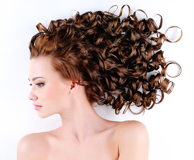 Woman with cascading, curly hair