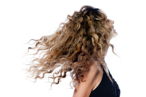 Woman with cascading curly hair